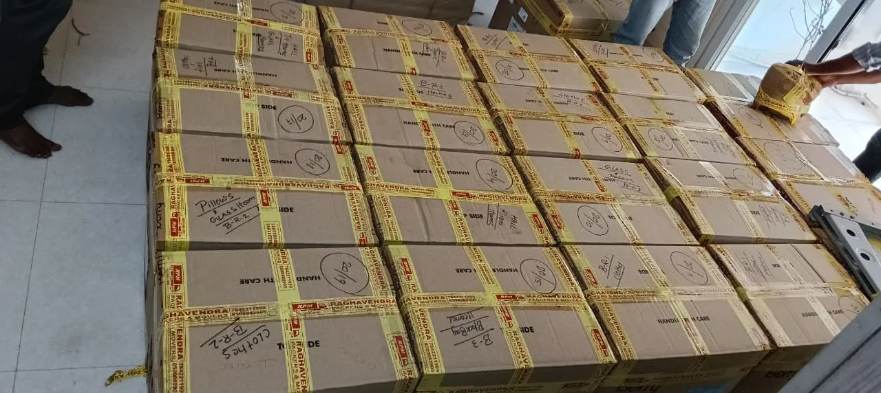 Moving cartons numbered and labelled by room for a house shifting job by packers and movers in Kakinada