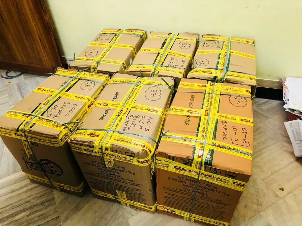 Office record files packed in numbered, taped cartons for office relocation in Kakinada