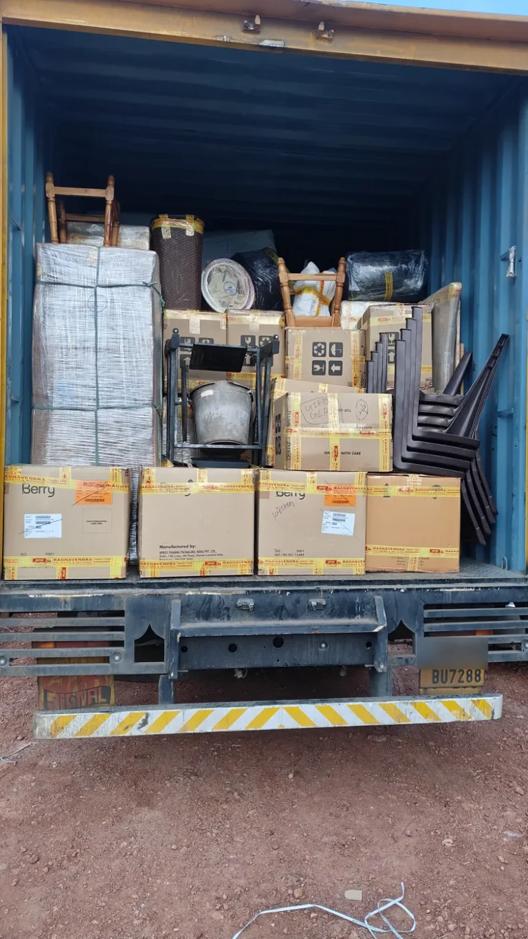 Cartons and furniture loaded in a container truck during house shifting by packers and movers in Kakinada